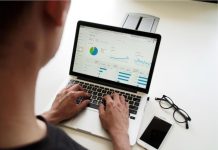 Developing an Effective Performance Analytics System A business analyst reviews a dashboard displaying performance analytics.