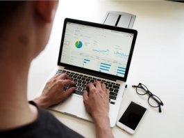 Developing an Effective Performance Analytics System A business analyst reviews a dashboard displaying performance analytics.